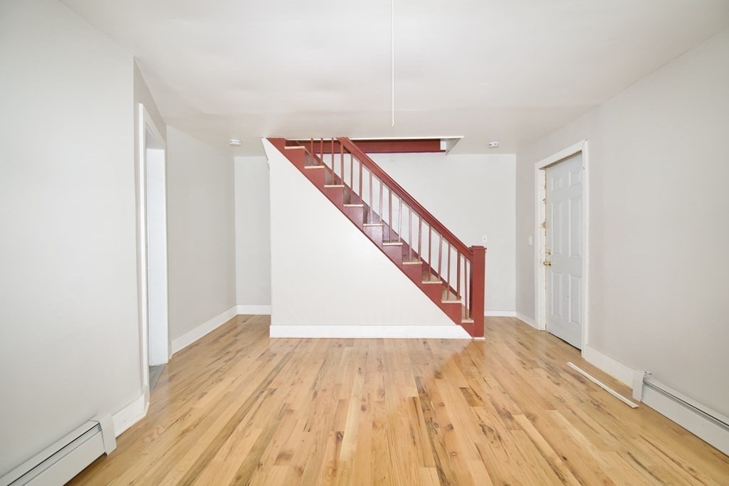 38 Collins Street Springfield, MA 01109 - Photo 13 of 39 a view of a hallway with wooden floor