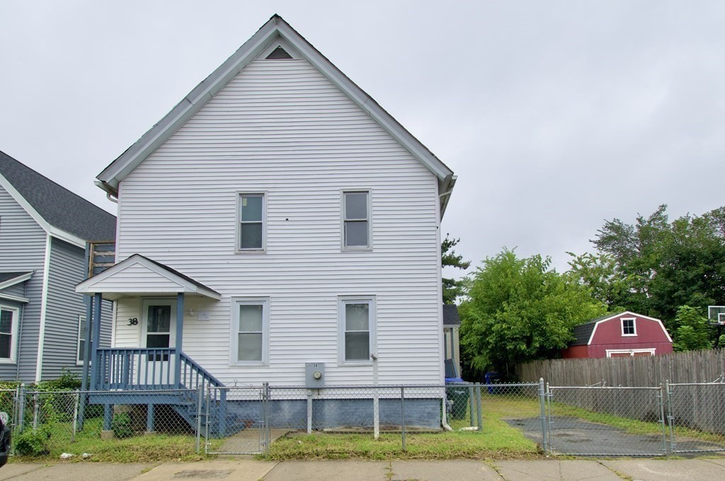 38 Collins Street Springfield, MA 01109 - Photo 3 of 39 a front view of a house with a yard