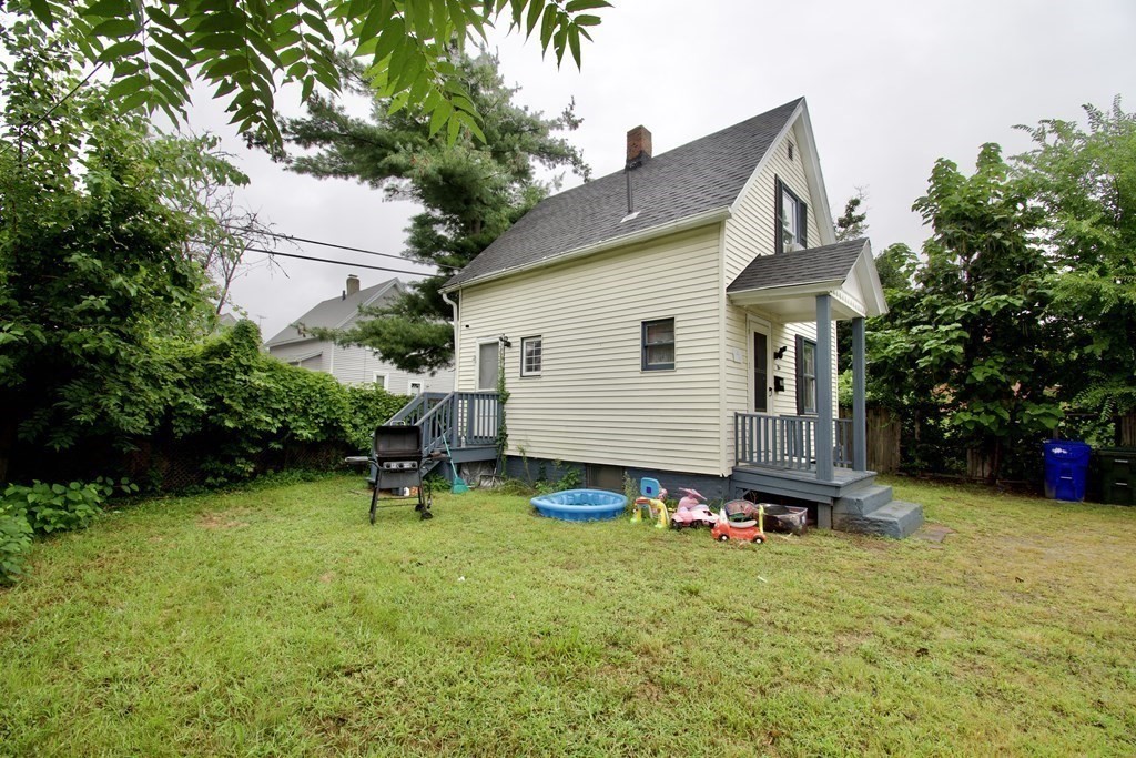 38 Collins Street Springfield, MA 01109 - Photo 34 of 39 a backyard of a house with table and chairs