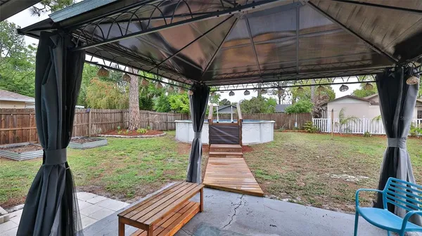 a balcony with wooden floor and outdoor space
