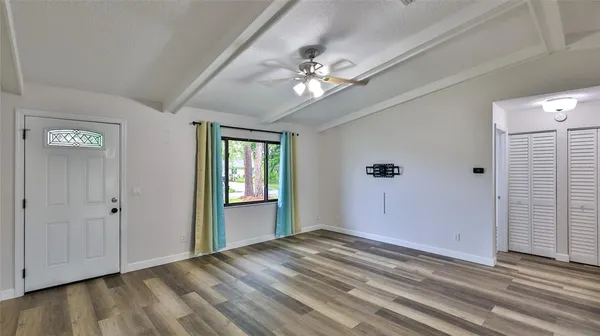 a view of an empty room with a window