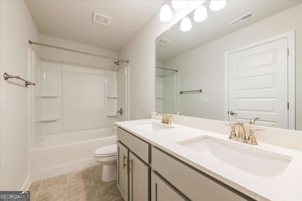 219 Carsons Walk Macon, GA 31206 - Photo 41 of 57 a bathroom with a sink a toilet and shower