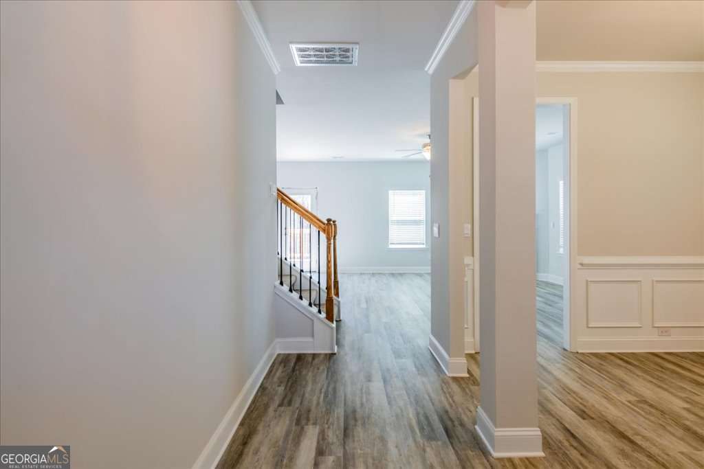 219 Carsons Walk Macon, GA 31206 - Photo 6 of 57 a view of a hallway with wooden floor and a bathroom