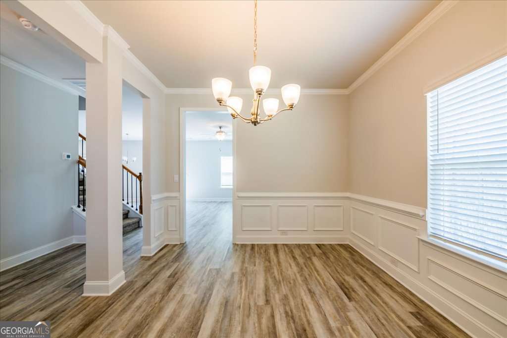 219 Carsons Walk Macon, GA 31206 - Photo 9 of 57 a view of a room with wooden floor and staircase