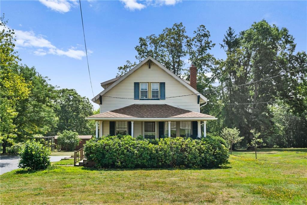 1557 Pittsburgh Road Franklin, PA 16323 - Photo 1 of 33 a front view of a house with a yard
