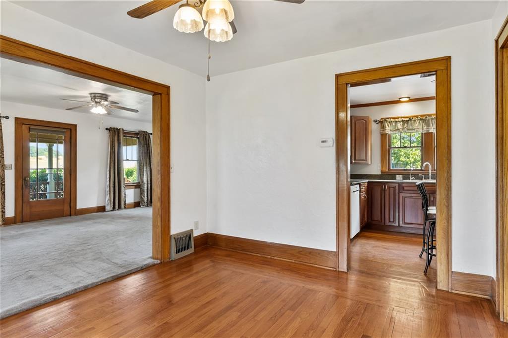 1557 Pittsburgh Road Franklin, PA 16323 - Photo 18 of 33 a view of a hallway with wooden floor and a livingroom