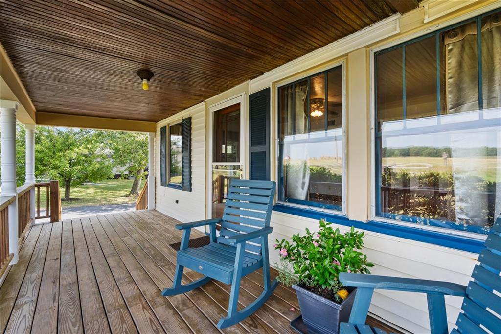 1557 Pittsburgh Road Franklin, PA 16323 - Photo 3 of 33 a view of a porch with furniture and wooden floor