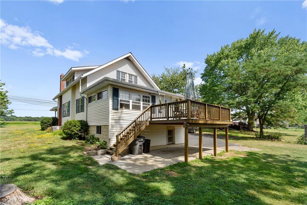 1557 Pittsburgh Road Franklin, PA 16323 - Photo 5 of 33 a backyard of a house with table and chairs