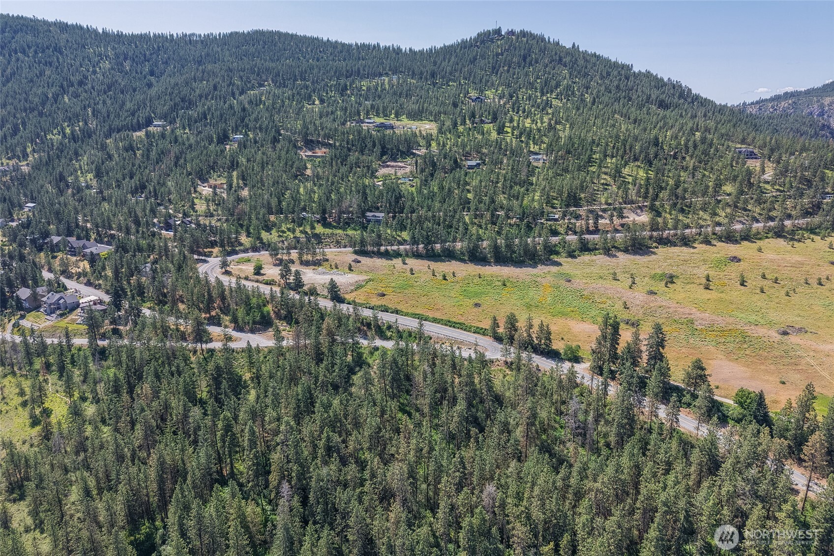 7-xxx Navarre Coulee Road Chelan, WA 98816 - Photo 11 of 30 a view of a lush green field with mountains in the background