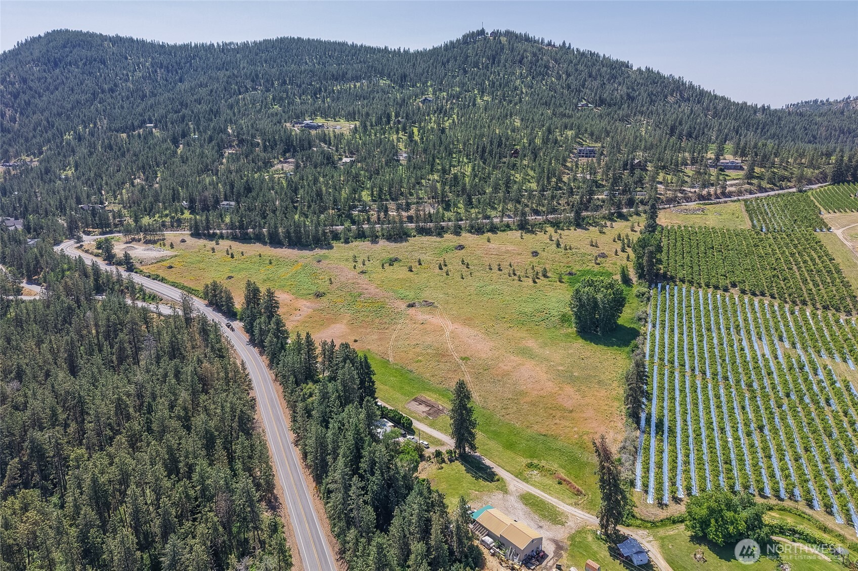 7-xxx Navarre Coulee Road Chelan, WA 98816 - Photo 12 of 30 a view of a swimming pool with a yard