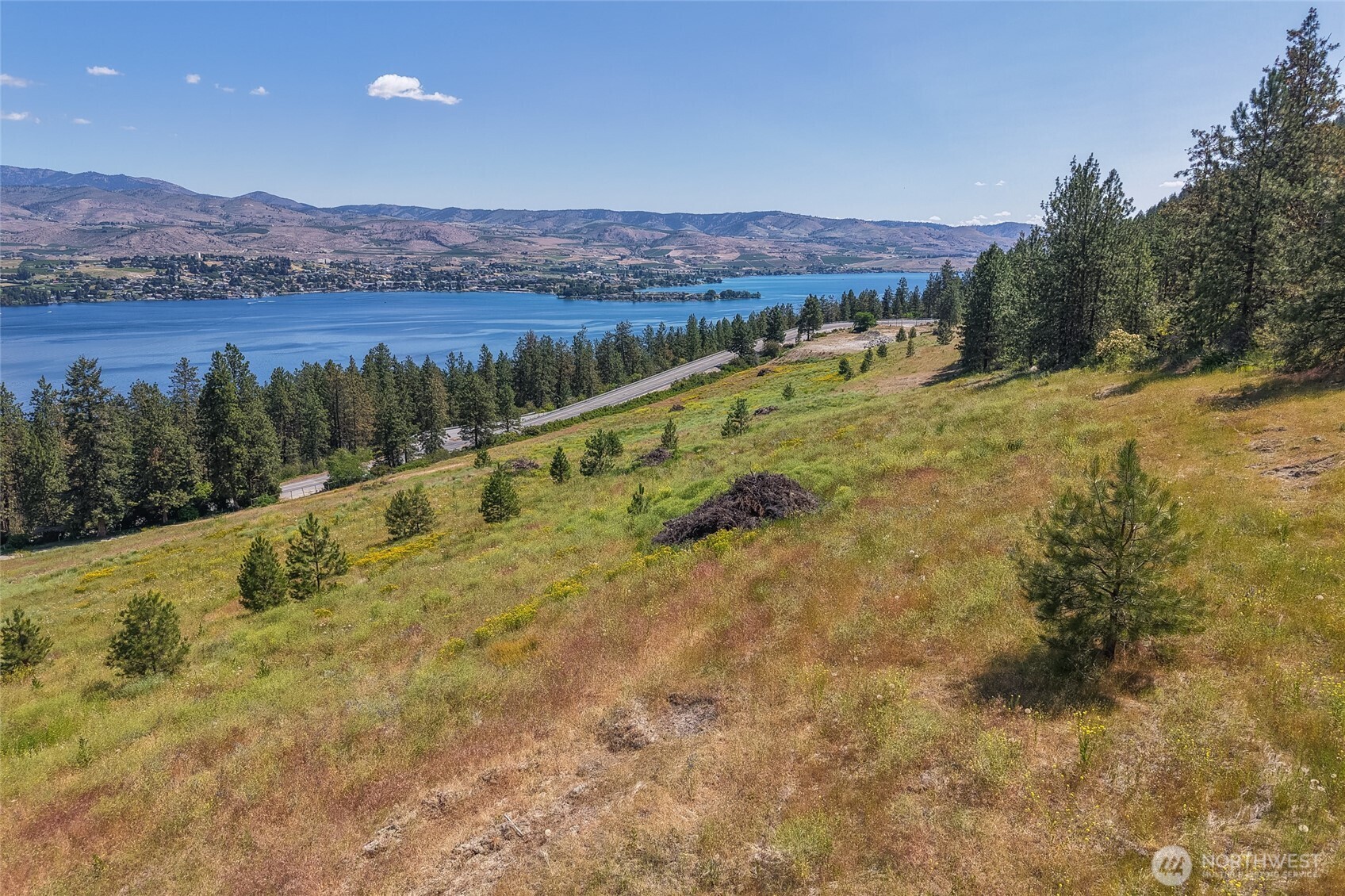 7-xxx Navarre Coulee Road Chelan, WA 98816 - Photo 17 of 30 a view of a lake with mountains in the background