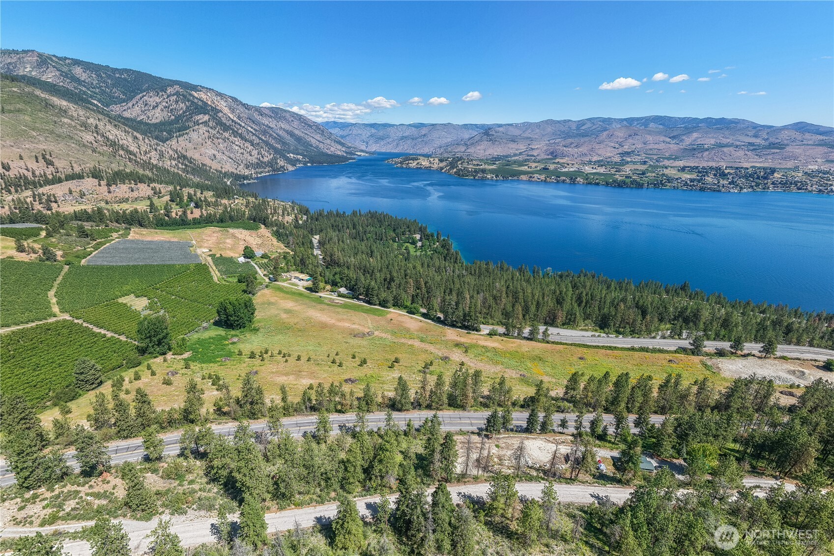 7-xxx Navarre Coulee Road Chelan, WA 98816 - Photo 3 of 30 a view of a lake with a mountain