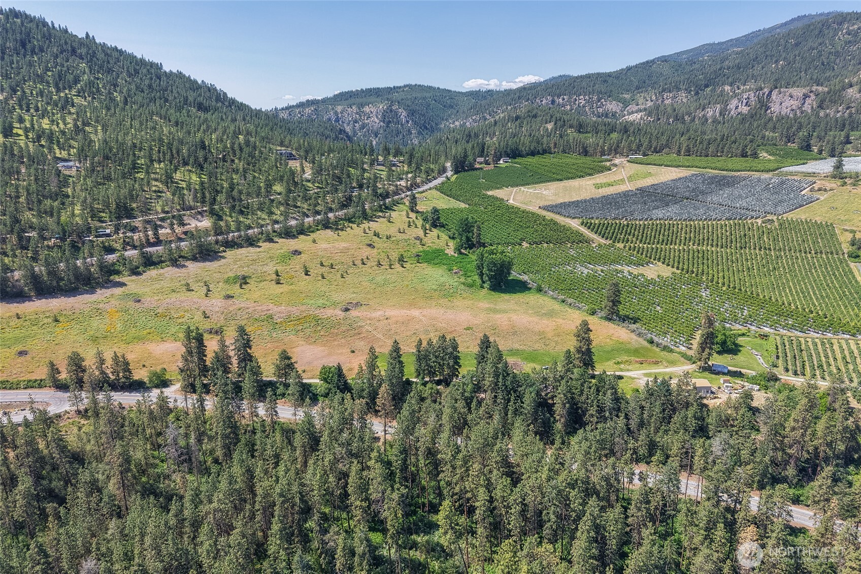 7-xxx Navarre Coulee Road Chelan, WA 98816 - Photo 10 of 30 a view of a lush green hillside and houses