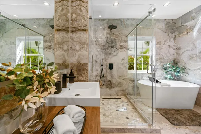 a bath room with a sink and a mirror