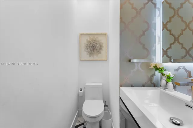 a view of a patio with table and chairs with wooden floor and fence