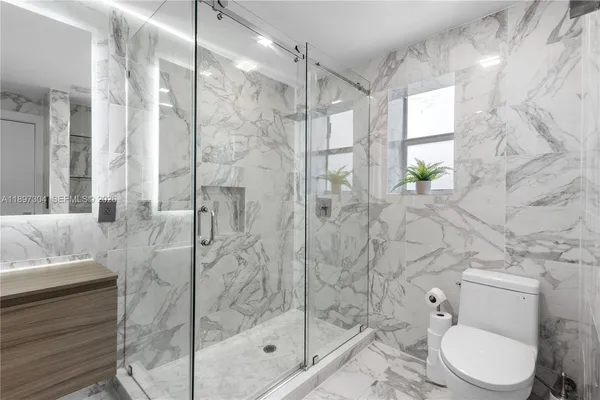 an aerial view of a city with lots of residential buildings