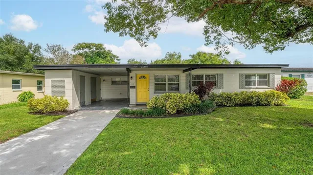 a front view of house with yard and green space