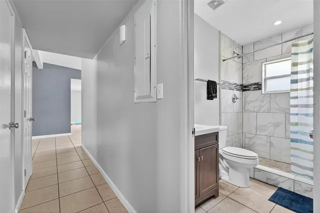 a view of an empty room with a window