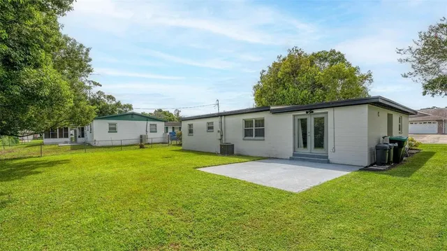 a view of a grassy field with trees