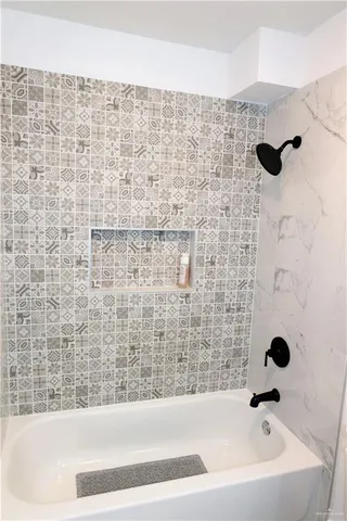 a view of a livingroom with a ceiling fan and a window