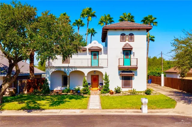 a front view of a house with yard
