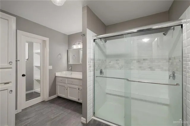 a view of a bathroom with closet and windows