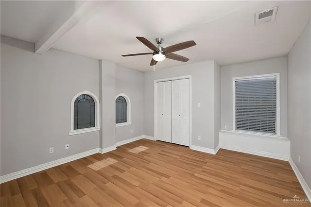 a bathroom with a sink a vanity a mirror and shower