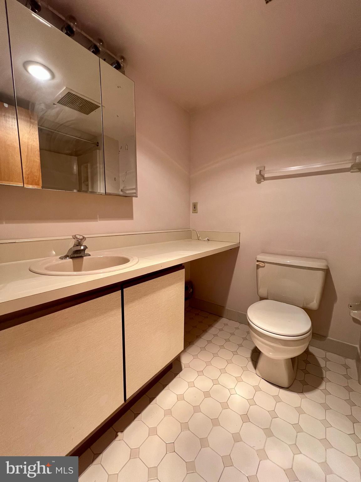 800 Avondale Road Wallingford, PA 19086 - Photo 14 of 14 a bathroom with a sink a toilet and mirror