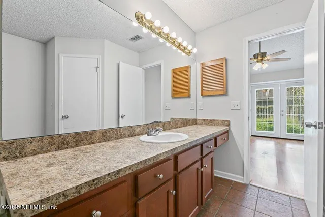 a front view of a house with a garden and yard