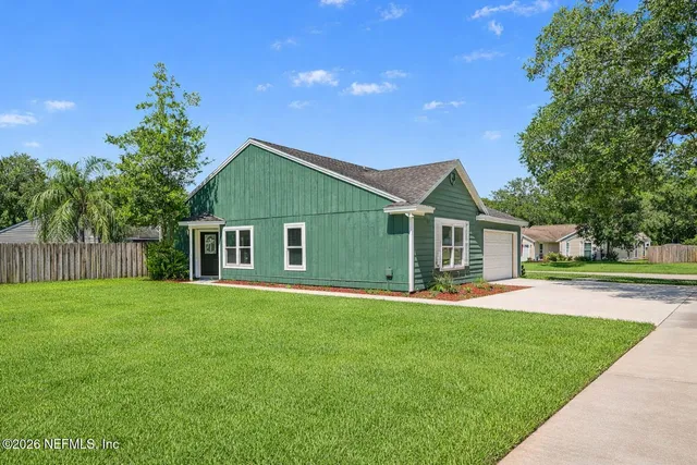 front view of a house with a yard