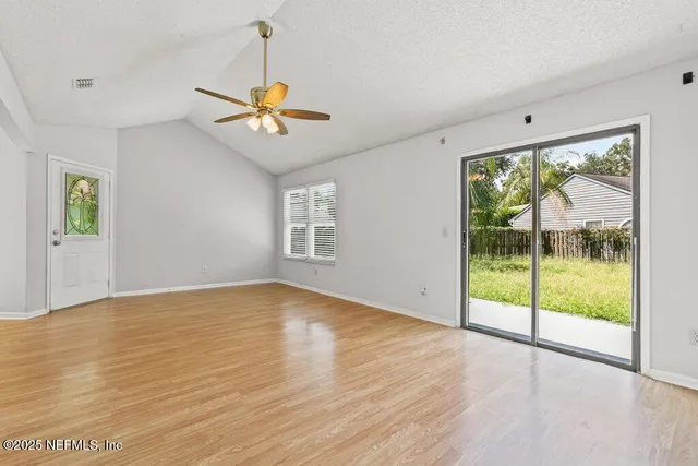 a view of an empty room with a window