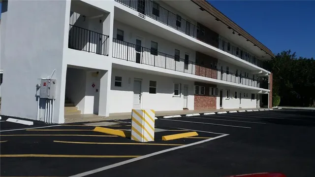 a front view of a building with street view