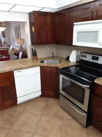 a kitchen with a stove and a sink