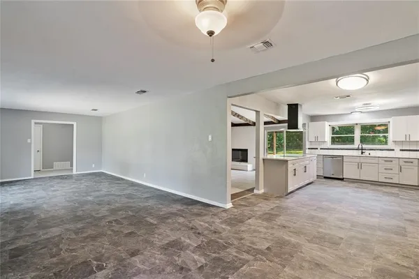 a view of a kitchen with a sink and cabinets