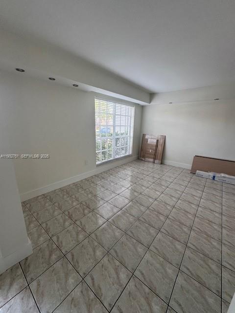 10351 Southwest 154th Place, Unit 68 Miami, FL 33196 - Photo 4 of 13 a view of an empty room and window