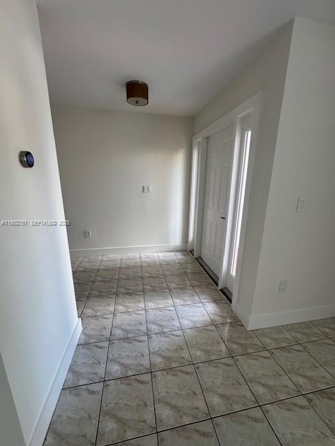 10351 Southwest 154th Place, Unit 68 Miami, FL 33196 - Photo 5 of 13 an empty room with a door
