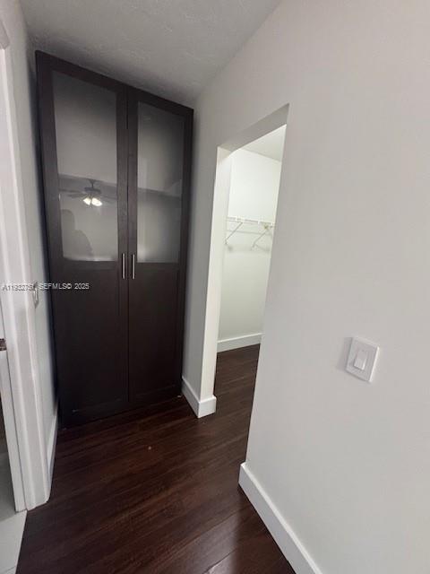 10351 Southwest 154th Place, Unit 68 Miami, FL 33196 - Photo 9 of 13 an empty room with wooden floor and entrance