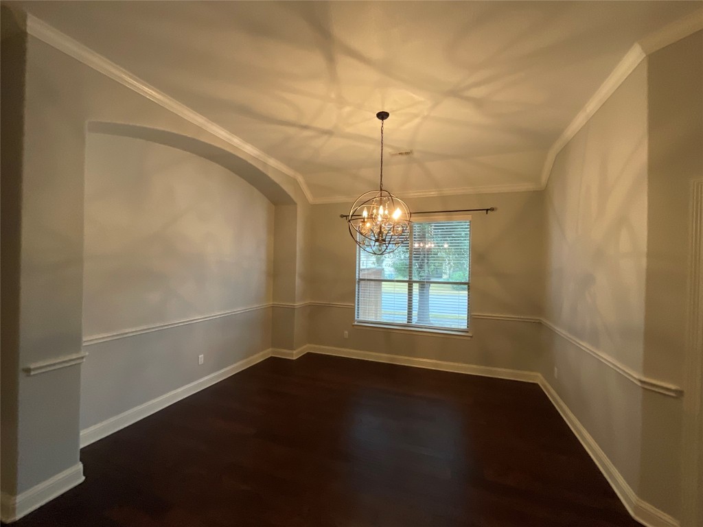 3928 Crest Lane Round Rock, TX 78681 - Photo 2 of 39 a view of wooden floor and a chandelier in a room