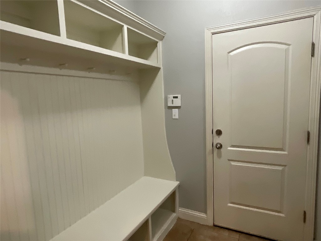 3928 Crest Lane Round Rock, TX 78681 - Photo 25 of 39 Mudroom featuring baseboards and tile patterned flooring