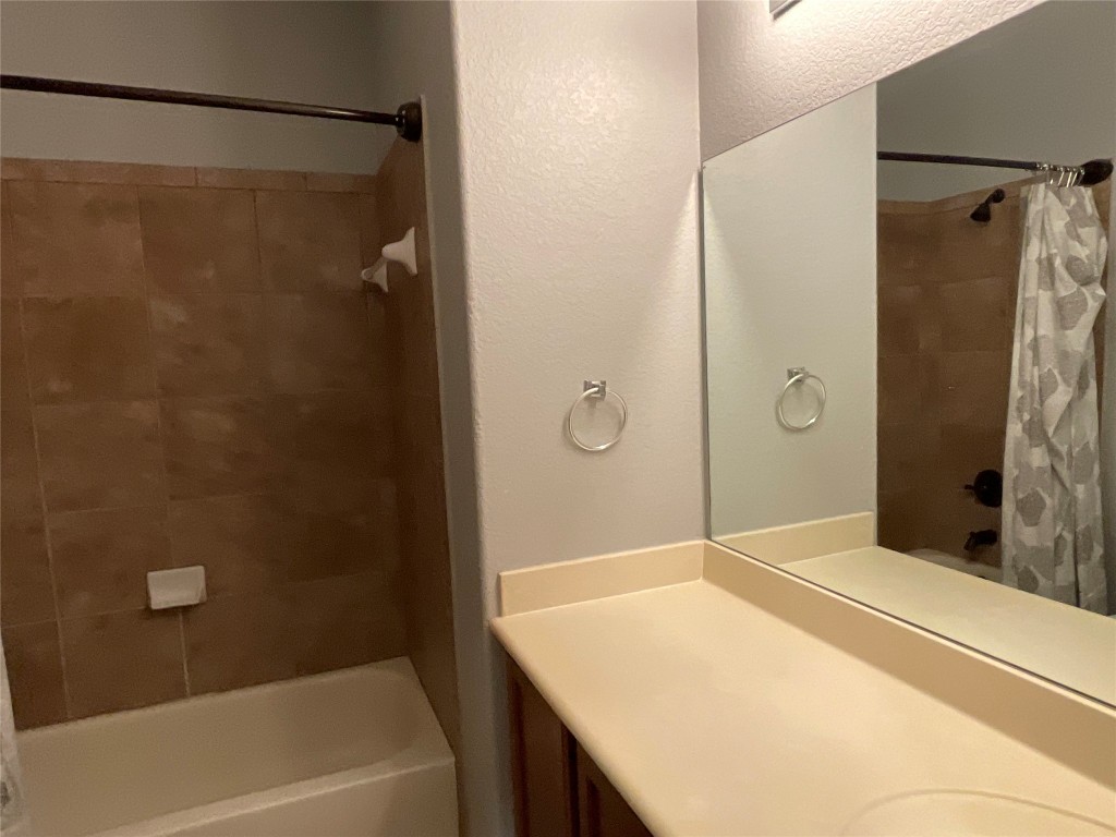 3928 Crest Lane Round Rock, TX 78681 - Photo 29 of 39 a bathroom with a shower and a tub