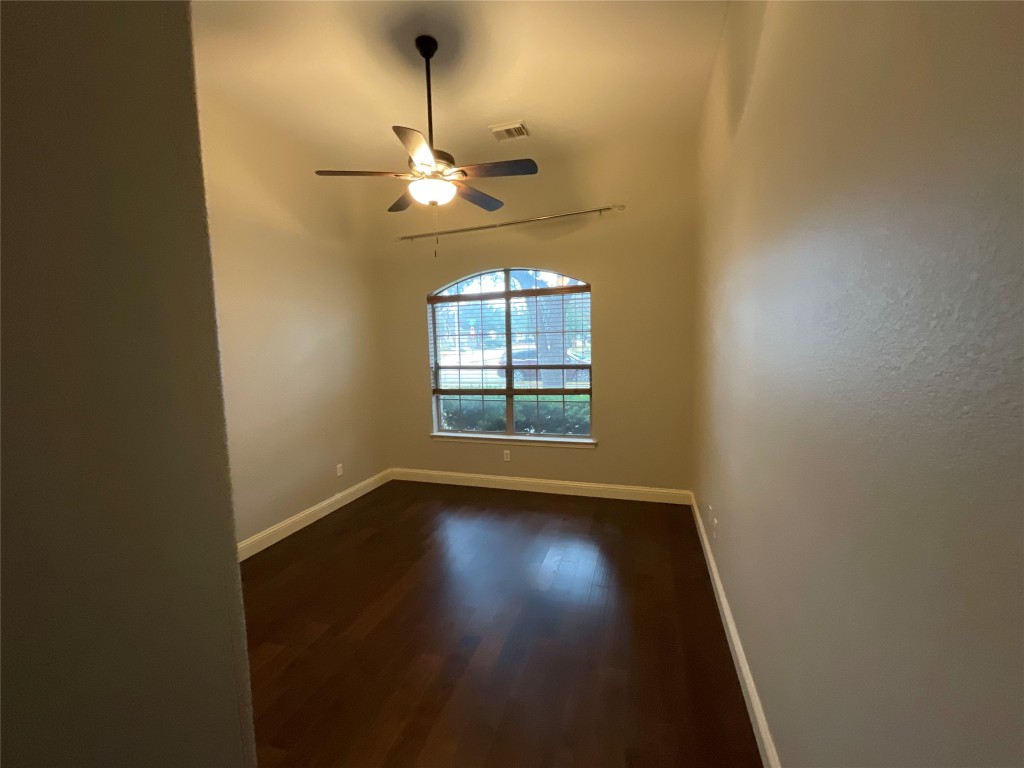3928 Crest Lane Round Rock, TX 78681 - Photo 33 of 39 an empty room with windows and fan