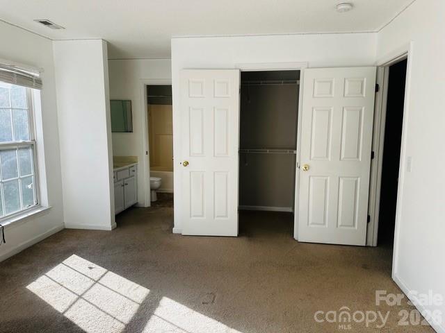 3406 Summerfield Ridge Lane, Unit 17 Matthews, NC 28105 - Photo 16 of 27 an empty room with windows