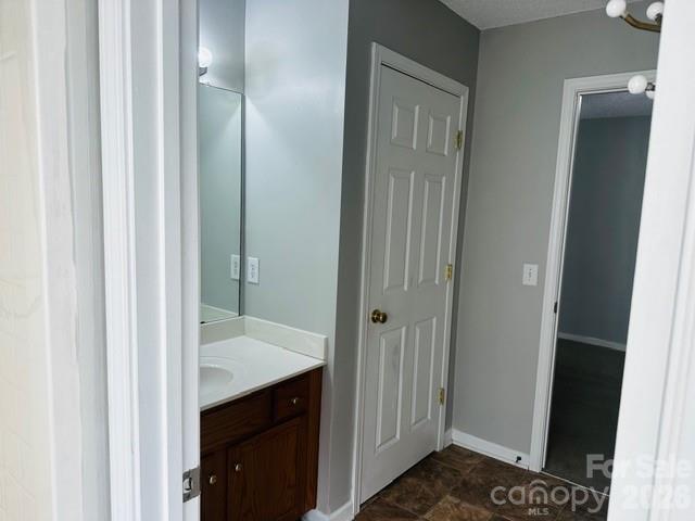 3406 Summerfield Ridge Lane, Unit 17 Matthews, NC 28105 - Photo 19 of 27 a view of bathroom with a sink and a mirror