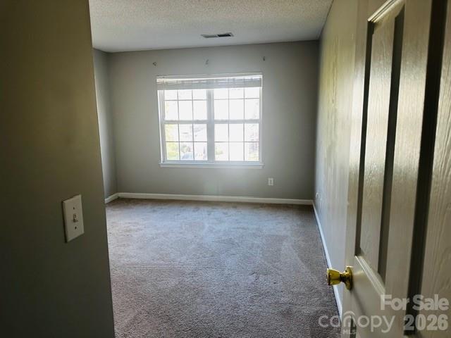 3406 Summerfield Ridge Lane, Unit 17 Matthews, NC 28105 - Photo 23 of 27 an empty room with windows