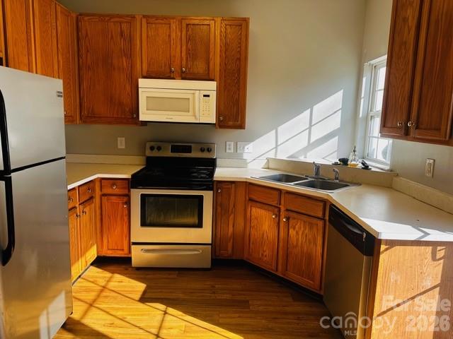 3406 Summerfield Ridge Lane, Unit 17 Matthews, NC 28105 - Photo 27 of 27 a kitchen with granite countertop a stove a sink and a microwave