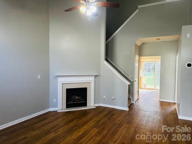 3406 Summerfield Ridge Lane, Unit 17 Matthews, NC 28105 - Photo 9 of 27 a view of empty room with wooden floor and fireplace