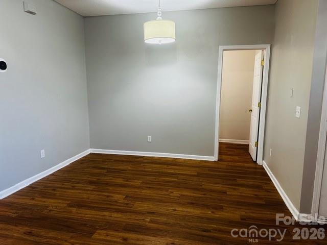 3406 Summerfield Ridge Lane, Unit 17 Matthews, NC 28105 - Photo 10 of 27 a view of a room with wooden floor and white walls