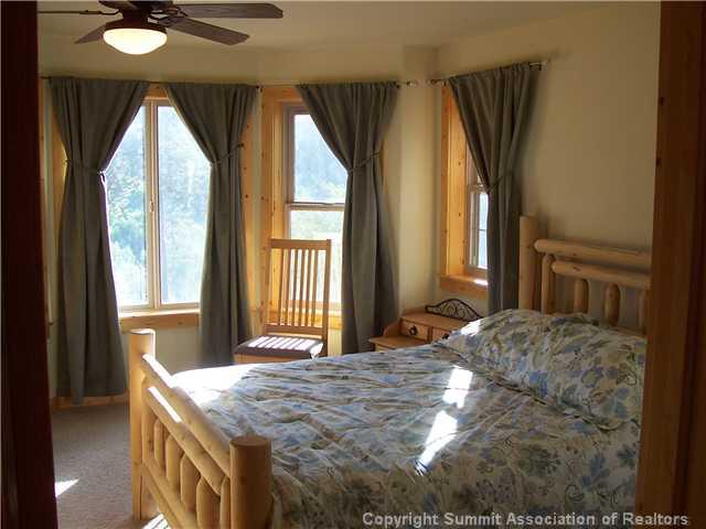 63 Osprey Road Como, CO 80432 - Photo 17 of 19 a bedroom with a bed and a large window
