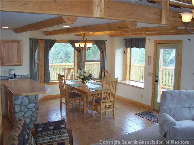 63 Osprey Road Como, CO 80432 - Photo 4 of 19 a view of a dining room with furniture wooden floor and a rug