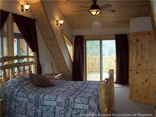 63 Osprey Road Como, CO 80432 - Photo 8 of 19 a bedroom with a bed dresser and a window